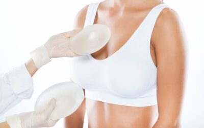 female doctor choosing mammary prosthesis with her patient white background 1301 7530 The Evolution of Breast Augmentation: Trends, Innovations, and Personal Journeys